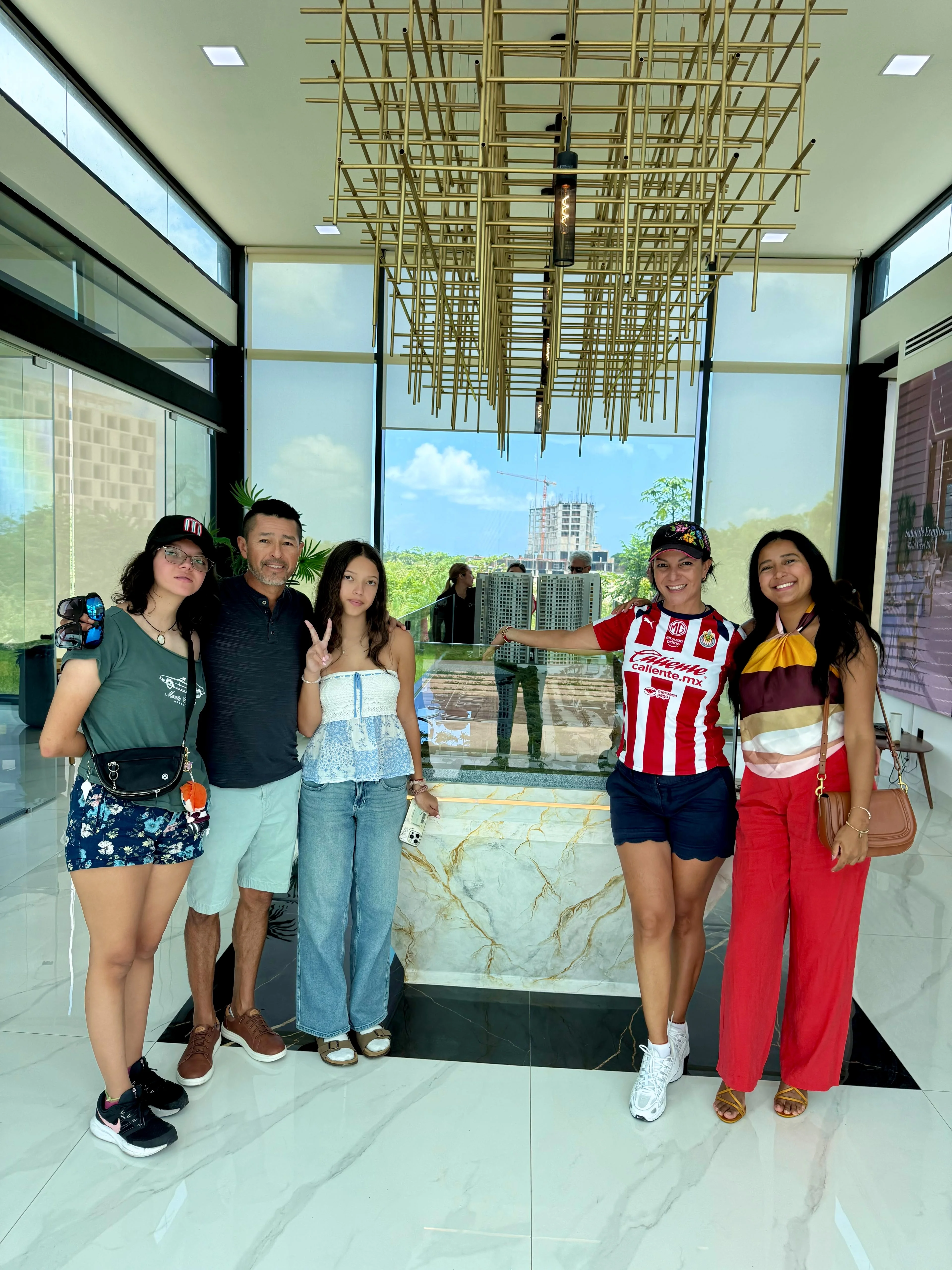 Lucero with clients at their new Riviera Maya home