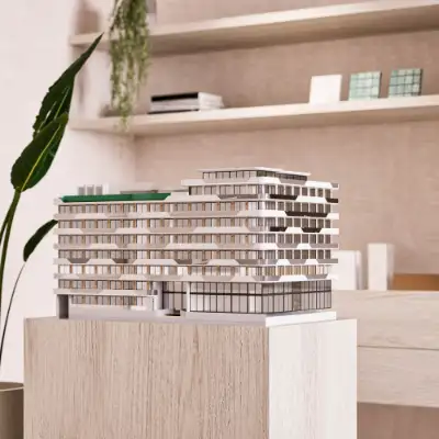 Architectural scale model of the Atzaro residential building showing its curved facade and terraces at Atzaro Residences, Playa del Carmen