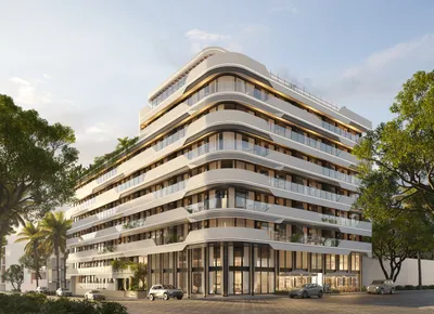 Curved white facade at Atzaro Residences, Playa del Carmen