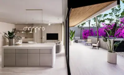 Open-concept kitchen and living area flowing onto a terrace with purple bougainvillea accents at Atzaro Residences, Playa del Carmen