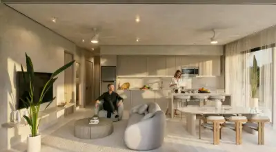 Spacious open-concept living, dining, and kitchen area with modern furnishings and natural light at Atzaro Residences, Playa del Carmen