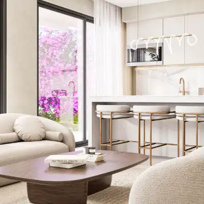 Living room with a curved sectional sofa and sliding glass doors leading to a private terrace at Atzaro Residences, Playa del Carmen