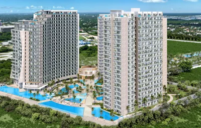 Aerial view of twin towers with pools at Aurora Towers, Cancun