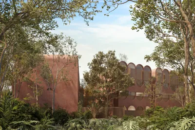 Pink facade in jungle setting at Babel Tulum