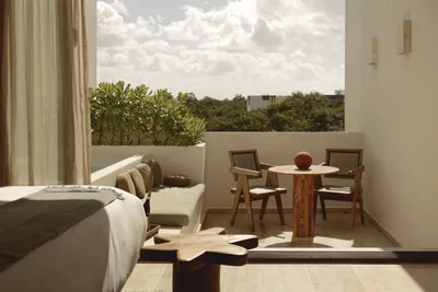 Balcony lounge with garden view at Bacab Tulum