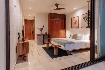 Bedroom with open door at Bacab Tulum