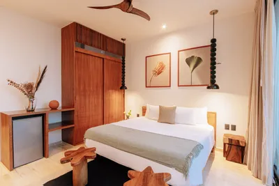 Bedroom with wood accents at Bacab Tulum