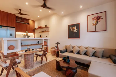 Living room with sofa and kitchen at Bacab Tulum