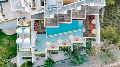 Aerial view of pool with umbrellas at Bacab Tulum
