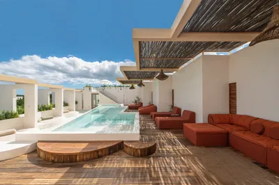 Rooftop jacuzzi with red lounge at Bacab Tulum
