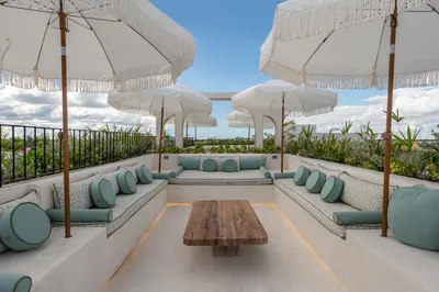 Rooftop lounge with umbrellas at Bacab Tulum