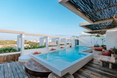 Rooftop pool with daybeds at Bacab Tulum