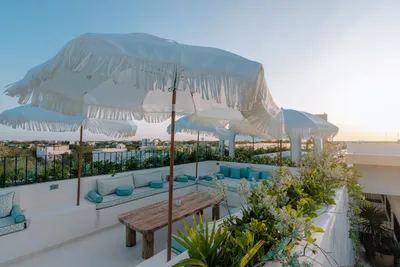 Rooftop pool with umbrellas at Bacab Tulum