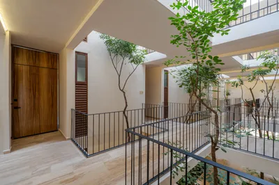 Staircase in courtyard with tree at Bacab Tulum