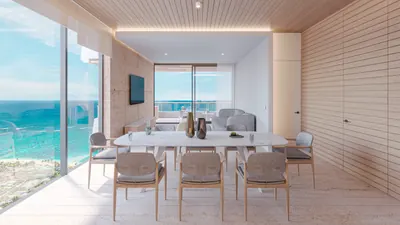 Dining room with glass walls and ocean view at BAO Puerto Morelos