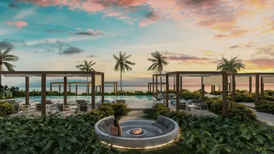 Rooftop lounge with fire pit at sunset at BAO Puerto Morelos