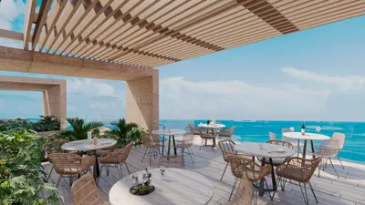Terrace dining under pergola with ocean view at BAO Puerto Morelos