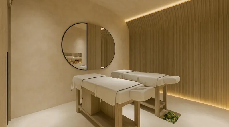 Sala de tratamiento de spa con área de masaje en spa wellness El Estero BLAS en Puerto Cancún