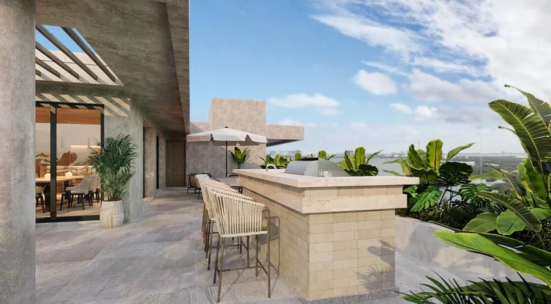 Terraza con cocina exterior y vistas al océano en residencia de lujo BLAS exterior en Puerto Cancún
