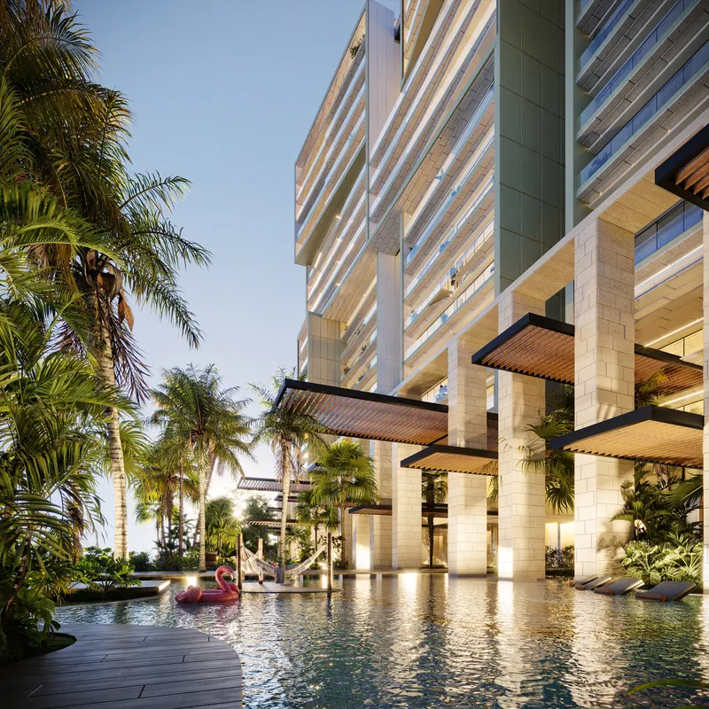 Entrada de torre con fuente de agua y arquitectura dramática en residencia wellness BLAS en Puerto Cancún