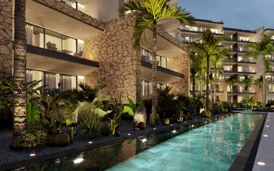 Fachada con piedra y alberca en Distrito Xcalacoco, Playa del Carmen
