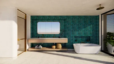 Designer bathroom with teal artisan tiles and sculptural freestanding tub at Faena Tulum Résidences