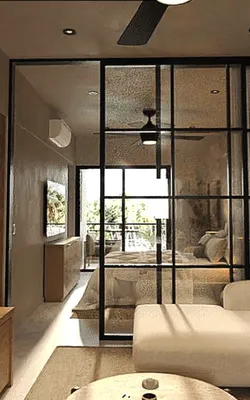Sala con división de vidrio en Gobernador 28, Playa del Carmen