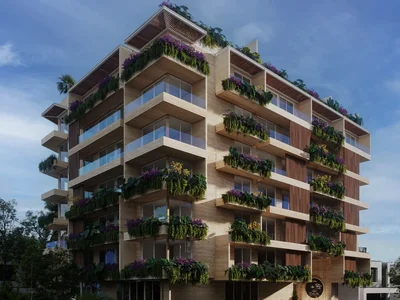 Fachada con jardines verticales y arquitectura orgánica en exterior de condominio sereno Idilik