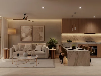 Sala con acentos de madera y diseño de cocina abierta en residencia wellness Idilik en Playa del Carmen