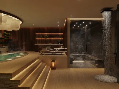 Alberca de spa con cascada y diseño tranquilo en condominio inspirado en wellness Idilik