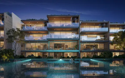 Residencia con albercas de noche en Macondo Playacar, Playa del Carmen
