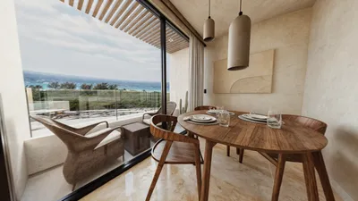 Comedor en balcón con vista a hamaca en Maia, Playa del Carmen