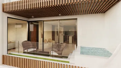 Terraza con alberca de inmersión y techo de madera en Maia, Playa del Carmen
