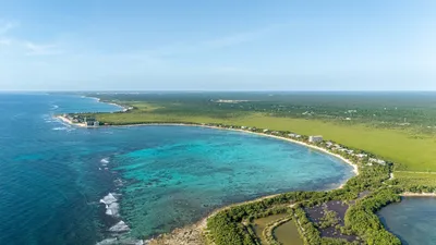Aerial panoramic view of the Caribbean shoreline and white sand beaches near Maranta Tulum
