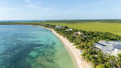 Aerial view of the Tulum lagoon and coastline near Maranta resort with turquoise Caribbean waters