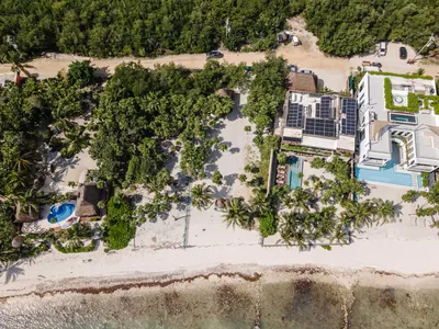Aerial view of Maranta Tulum masterplan showing resort pools, residences, and preserved jungle vegetation