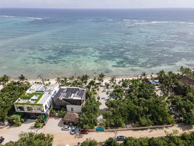 Aerial view of Maranta resort nestled between tropical jungle and Caribbean beach in Tulum
