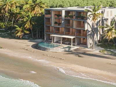 Beachfront pool with white sand and Caribbean views at Maranta Tulum resort