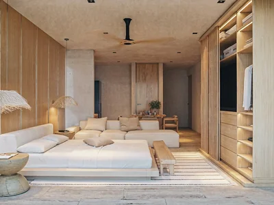 King bedroom with fluted wood accent wall and tropical design at Maranta Tulum residence