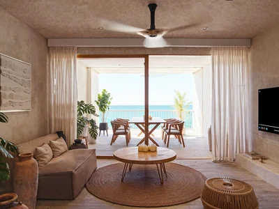 Living room with panoramic ocean views and contemporary furnishings at Maranta Tulum