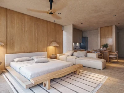 Master bedroom with oak paneling and luxury finishes at Maranta Tulum beachfront resort