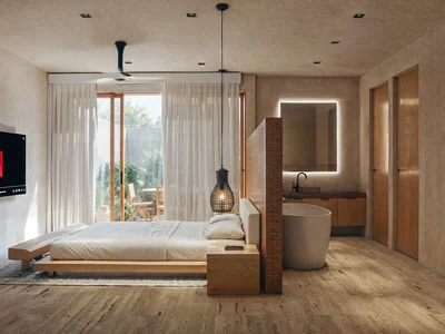 Studio apartment with platform bed and private balcony at Maranta Tulum jungle condominium