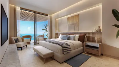 Bedroom with ocean view and balcony access at Marietta Residencias, Isla Mujeres