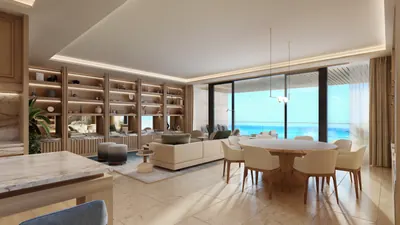 Living and dining area with ocean view and bookshelves at Marietta Residencias, Isla Mujeres