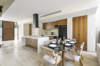 Kitchen and dining area in open-concept layout at Mistiq Villas, Tulum