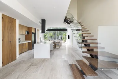 Loft kitchen with staircase at Mistiq Villas, Tulum