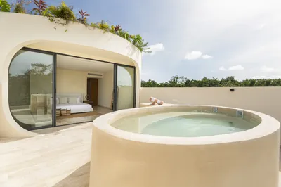 Rooftop circular pool with bedroom view at Mistiq Villas, Tulum