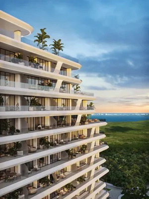 Curved tower facade with ocean view at Nautica Residences, Cancun