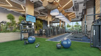Gym with turf fitness area and wood ceiling at Nautica Residences, Cancun