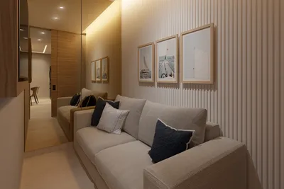 Living room with sofa and wood paneling at Nautica Residences, Cancun